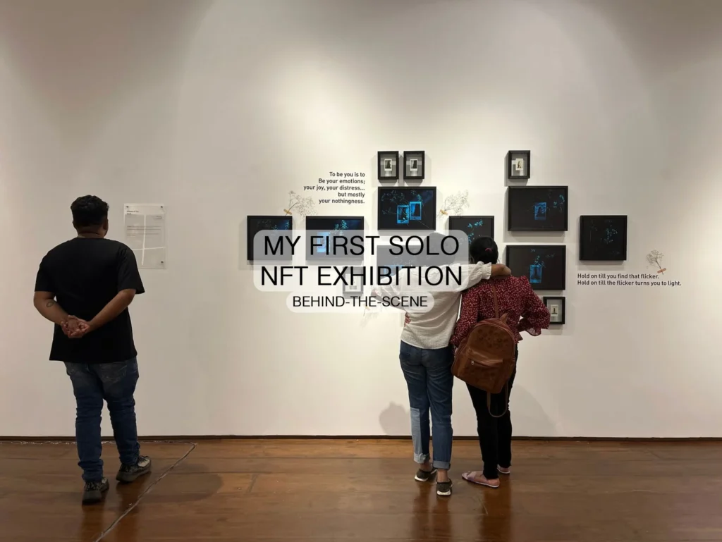 Behind-the-scenes image of a first solo NFT exhibition showcasing digital artwork and emotional storytelling in a gallery setup.